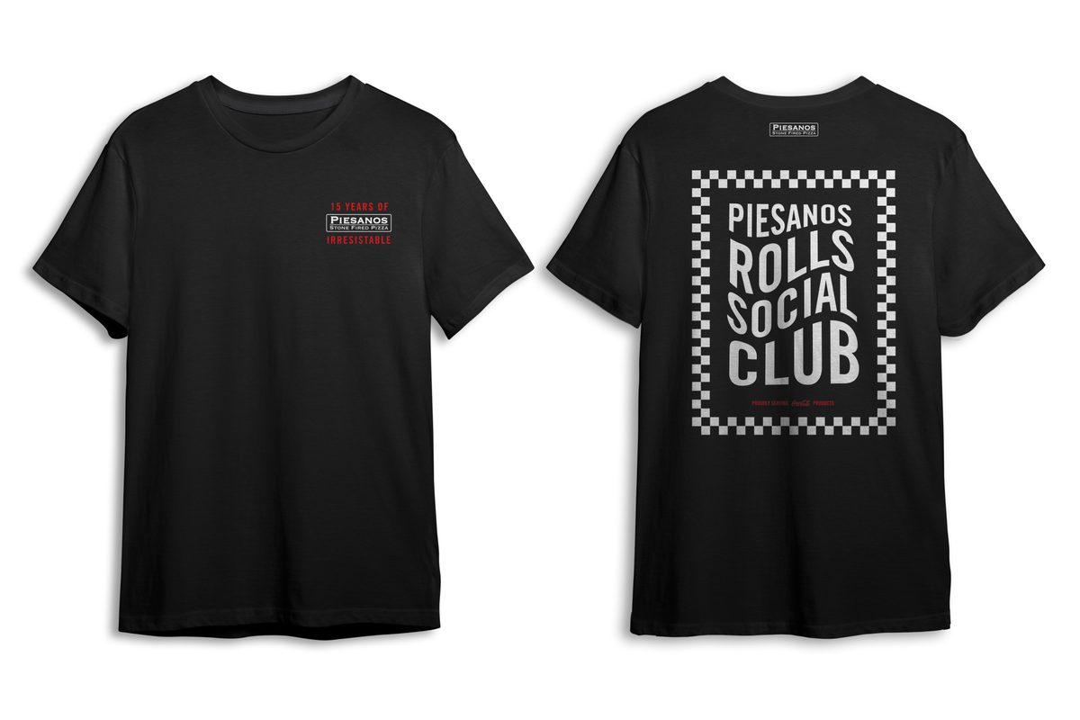 A black t-shirt is displayed with its front on the left and back on the right against a bright white background. The front of the shirt features red text reading "15 YEARS OF" and "IRRESISTIBLE," with "PIESANOS STONE FIRED PIZZA" in a white box below it. The back of the shirt displays "PIESANOS ROLLS SOCIAL CLUB" in large white text, surrounded by a white and gray checkered border, with a smaller "FOREVER ROLLING SINCE 2008" underneath.